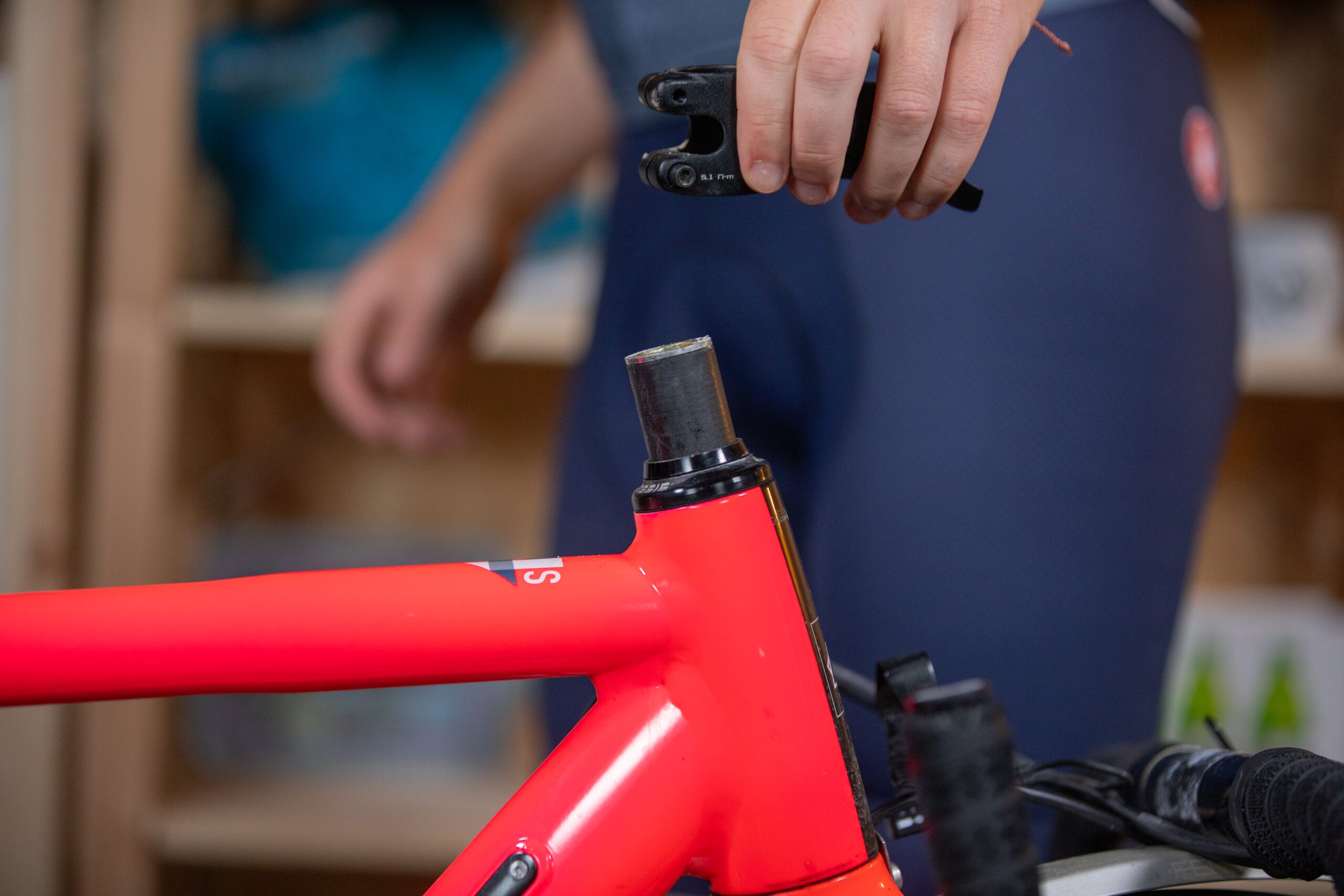 Liam Cahill adjusting stem on a Kinesis road bike