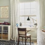 Striped curtains in a boy's room: A visual example from our curtain hanging guide.