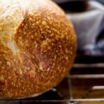 Close-up of a crusty sourdough loaf with visible air bubbles