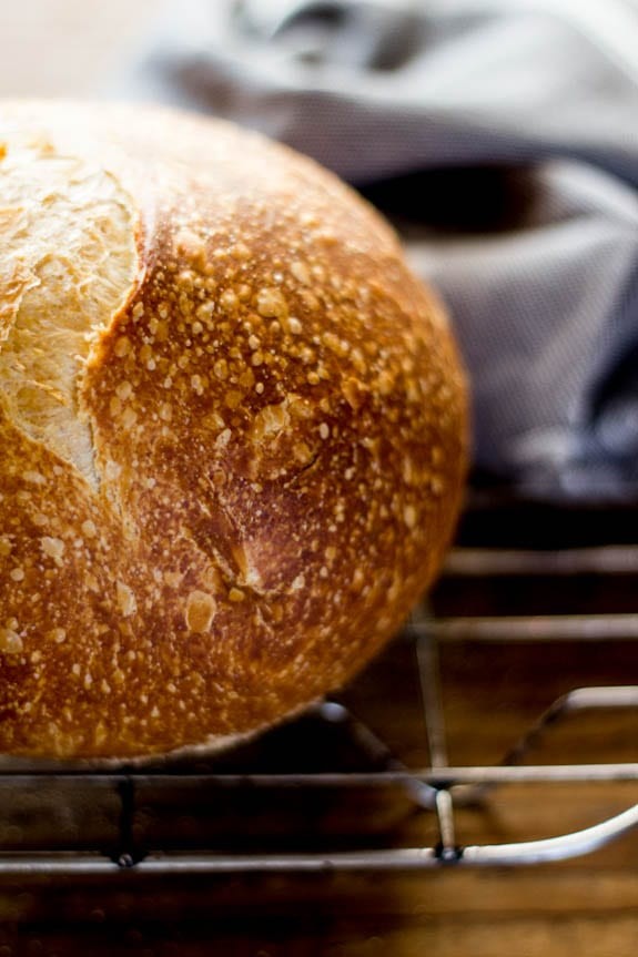 Close-up of a crusty sourdough loaf with visible air bubbles