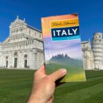 Rick Steves guidebook being used in Pisa, Italy