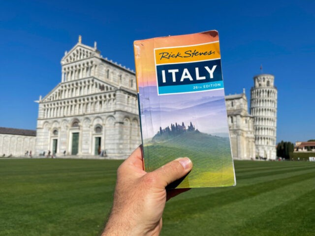 Rick Steves guidebook being used in Pisa, Italy