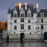 Château de Chenonceau at sunset, Loire Valley, France, showcasing the romantic scenery and historical charm of the region, ideal for wine tours and cultural explorations.