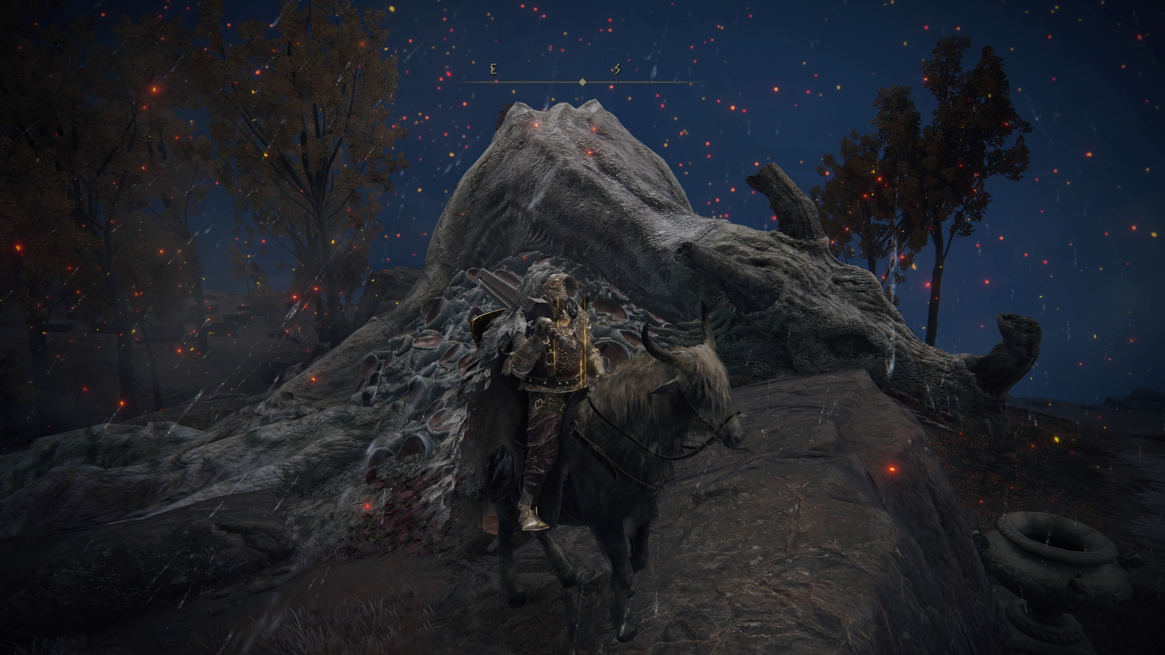 The player character sits astride Torrent next to a dead dragon in Elden Ring