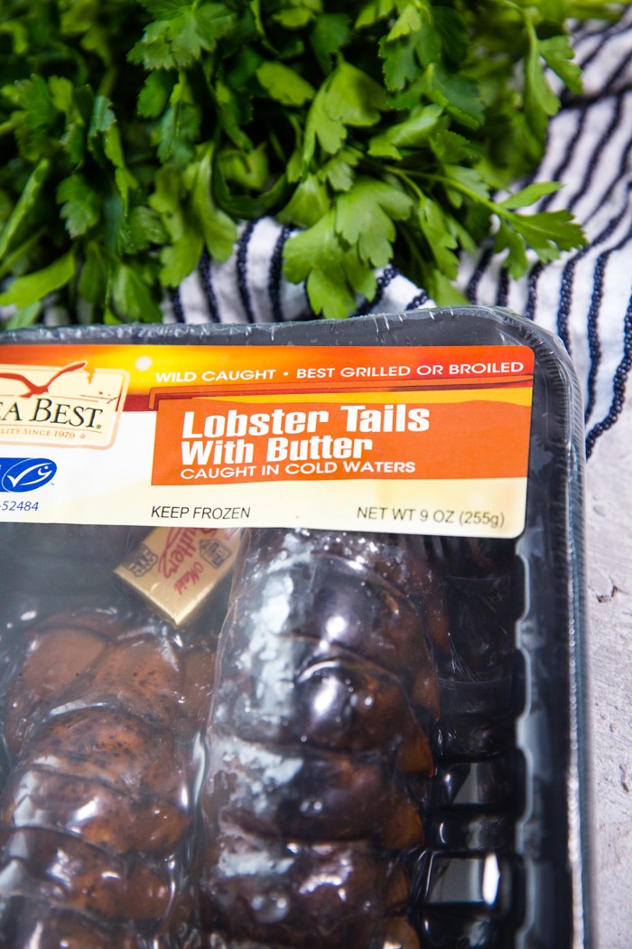 A package of cold water lobster tails with a clear label indicating their origin.