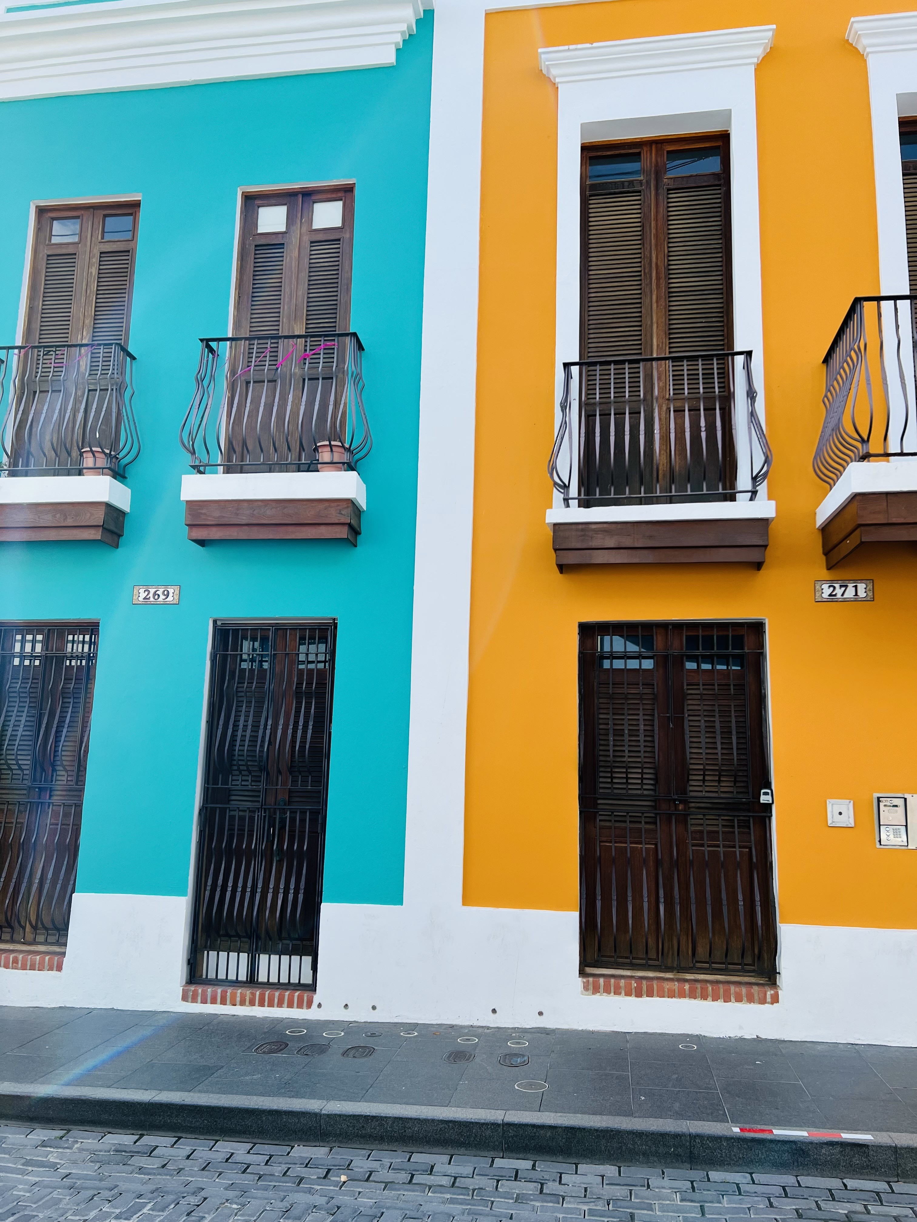 Street view in San Juan, Puerto Rico showcasing colorful buildings and a vintage car