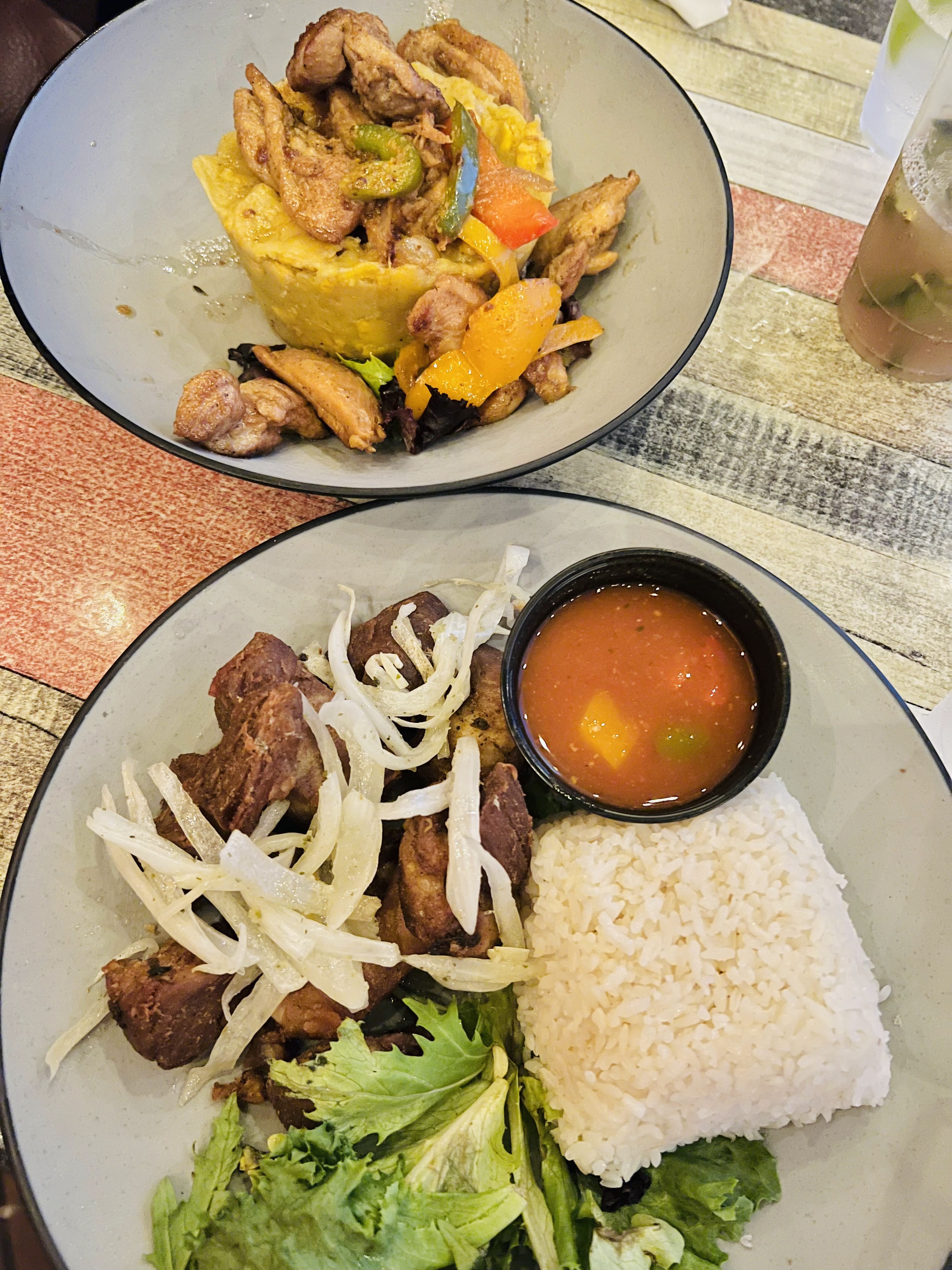 A plate of traditional Puerto Rican food at La Verguenza restaurant