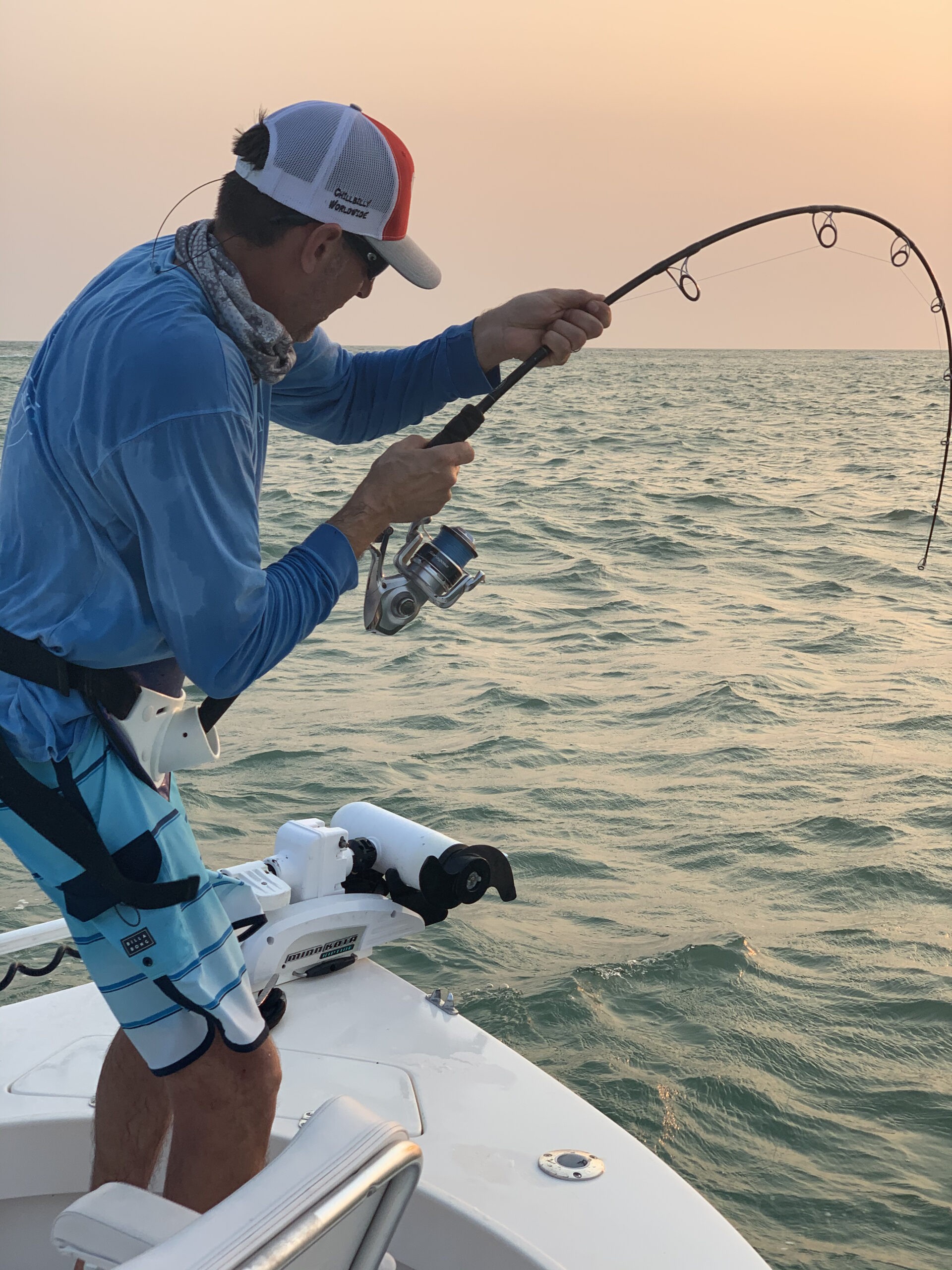 Angler proudly displays a sizable catch during a fishing trip.