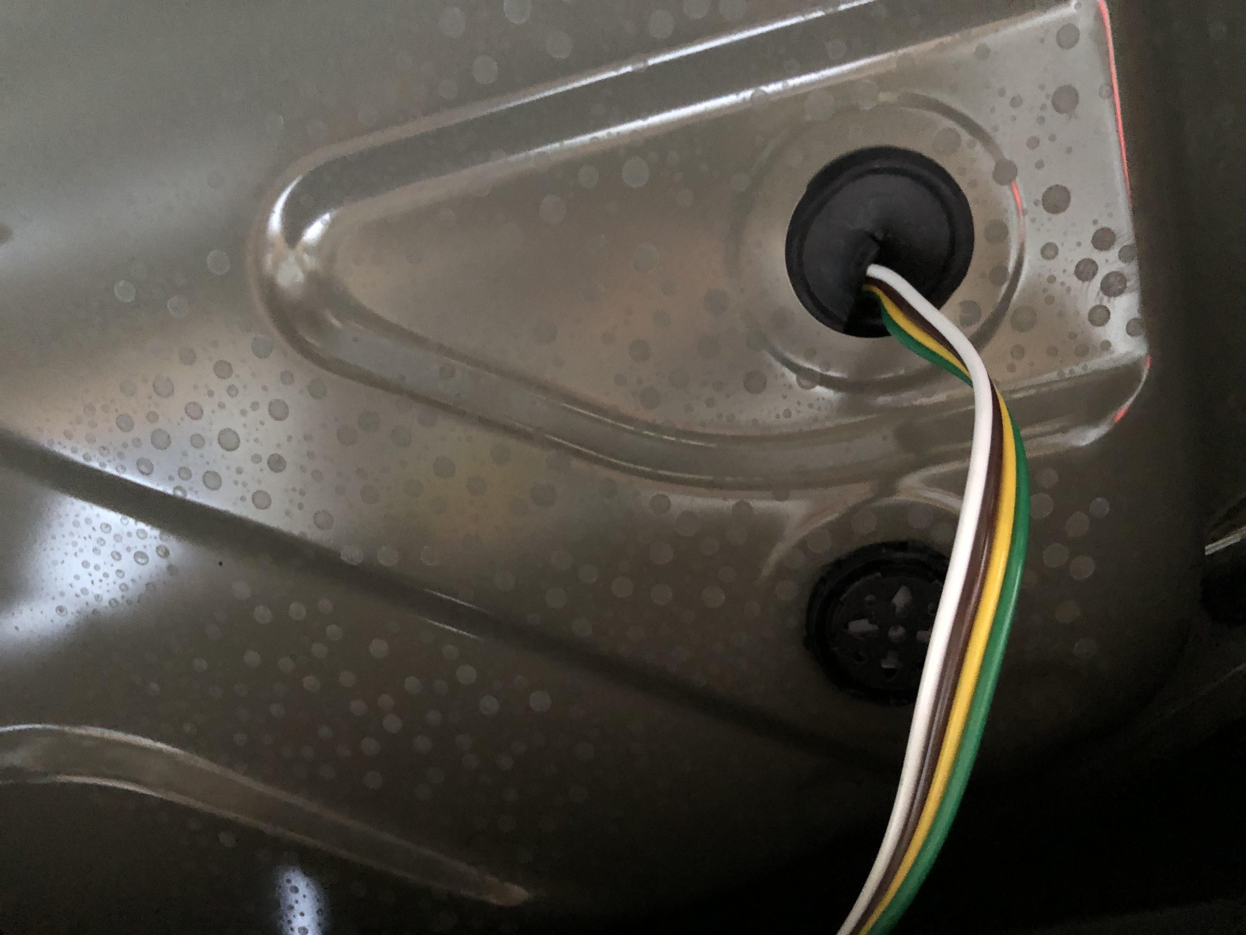 Rubber grommets in the well of the trunk