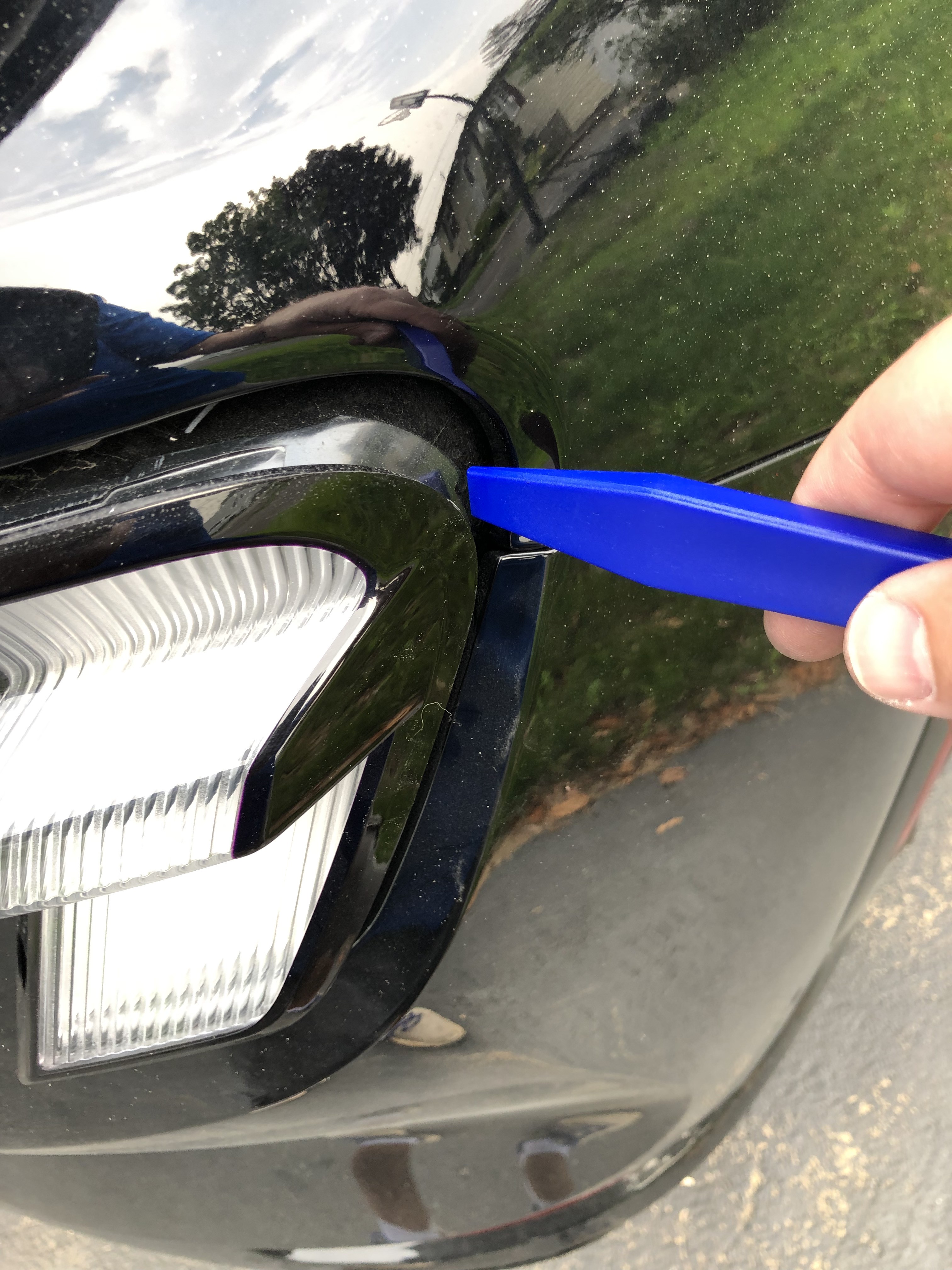 Popping the LED enclosure out of the pressure retaining clips