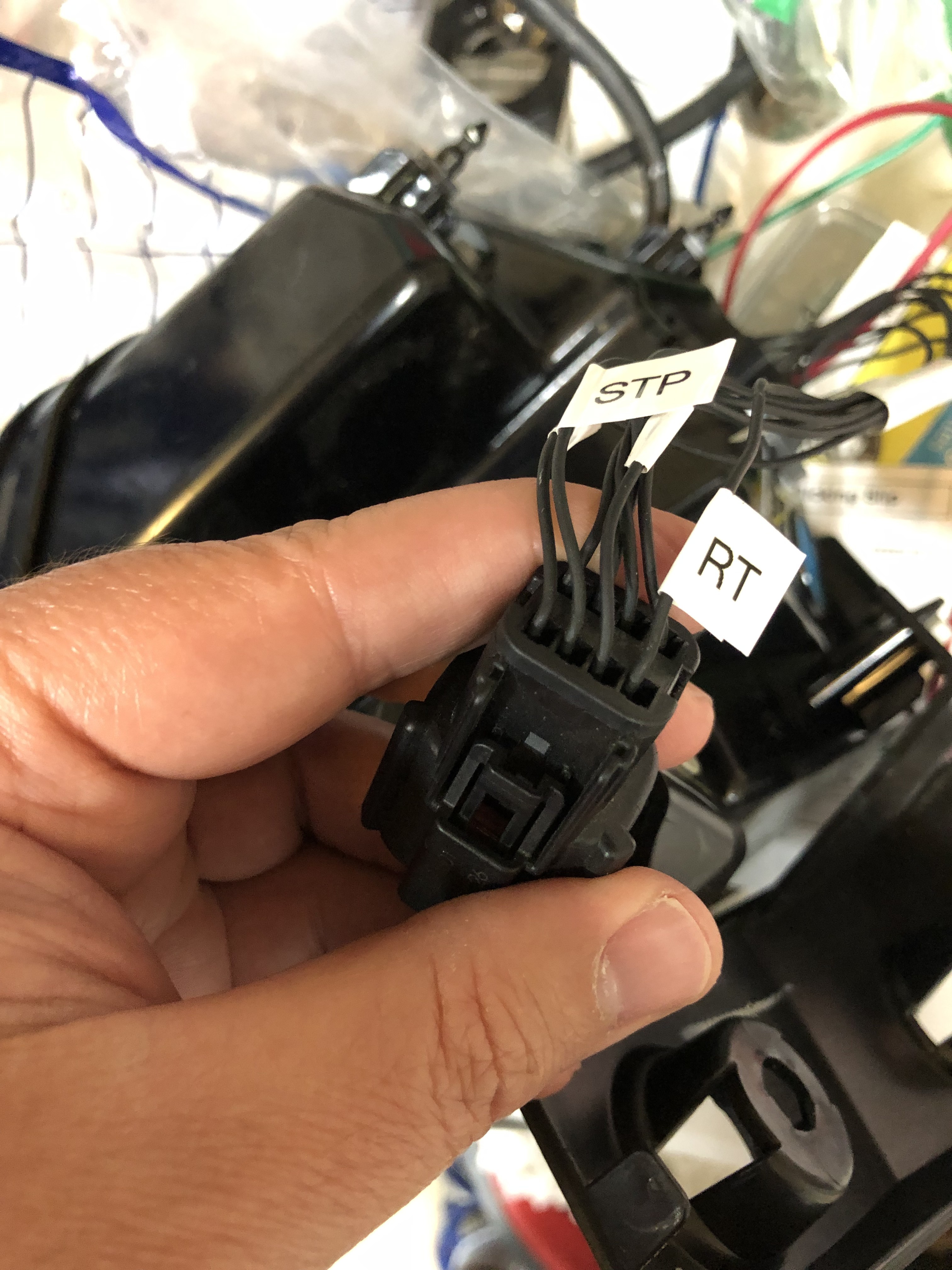 Close up of the passenger side light enclosure pigtail showing the labels on the wires corresponding to pins 1 and 3