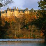 Autumn leaves frame the Biltmore Estate in Asheville, North Carolina.