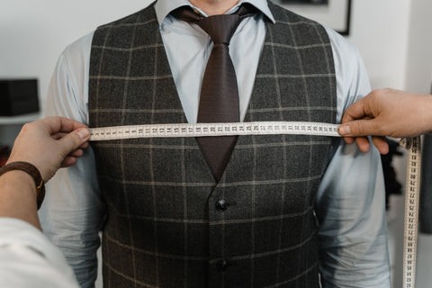 Measuring chest size for a men's dress shirt, wrap the measuring tape around the fullest part of the chest.