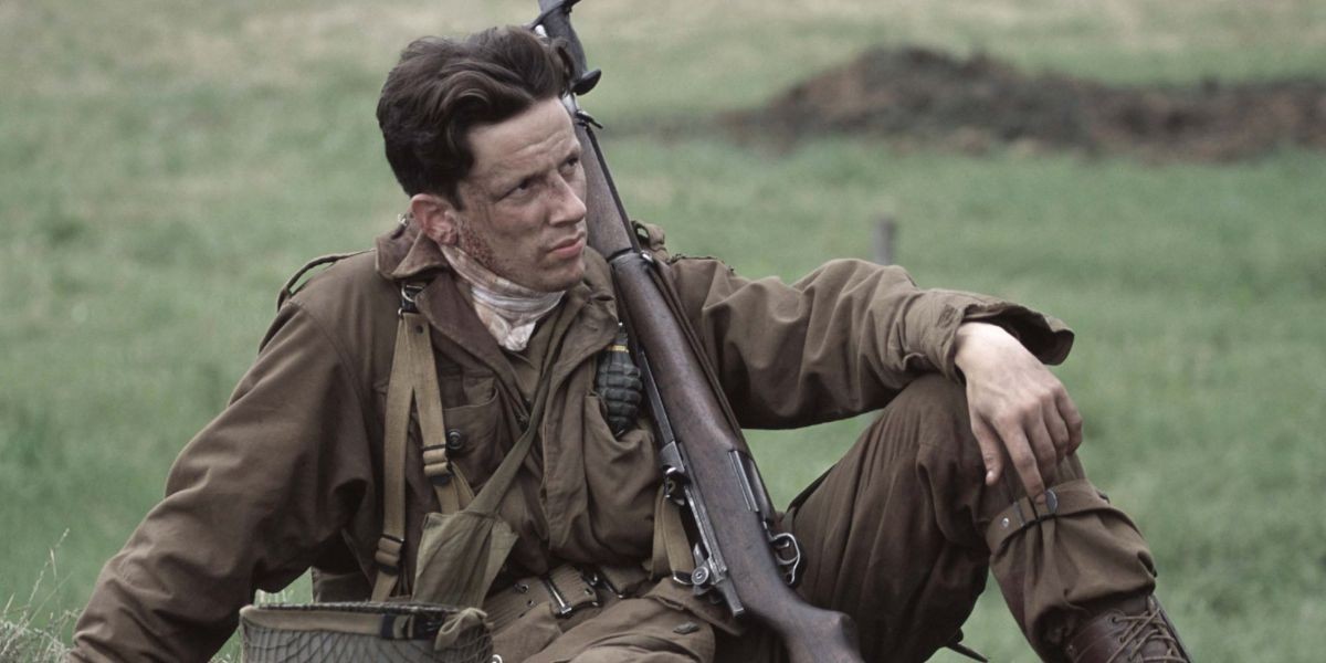 Ross McCall As Joseph D. Liebgott sitting on the ground with his rifle in Band of Brothers