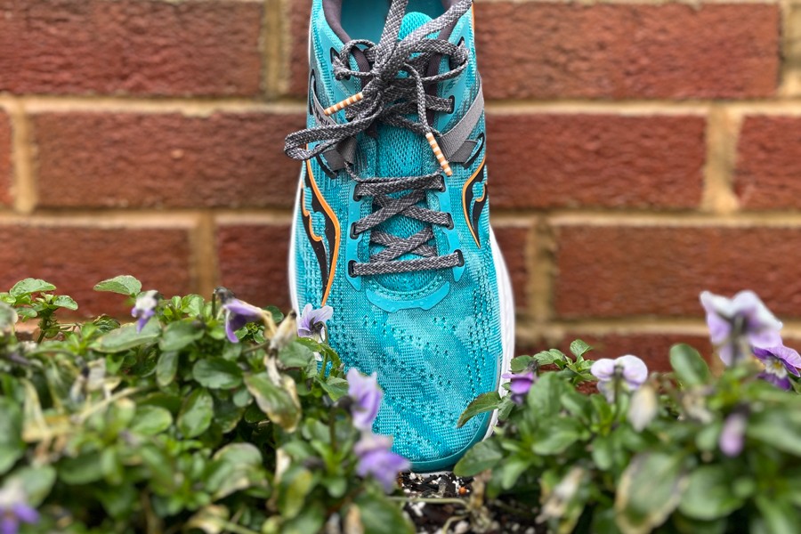 Close-up of the laces and engineered mesh upper of the Saucony Guide 16 stability running shoe, highlighting the updated design for enhanced comfort and support.