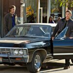 Supernatural Season 1 promotional image featuring the Impala and the Winchester brothers.