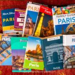 A collection of Paris travel guide books displayed in a bookstore, showcasing various titles and cover designs