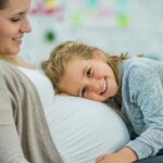 Two Young Girls Laughing and Playing Together