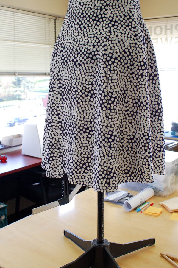 Fabric preparation for hemming, showing ironing and marking