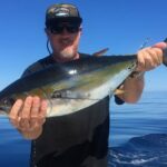 Captain Posing With Impressive Fish Catch