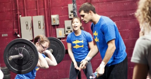 The advantage of getting cheered on while lifting weights during a CrossFit session, boosting motivation and performance
